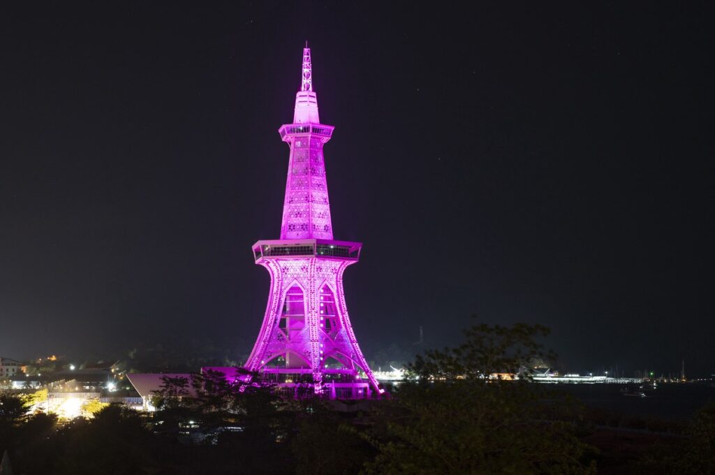 Maha Tower at night with purple lights