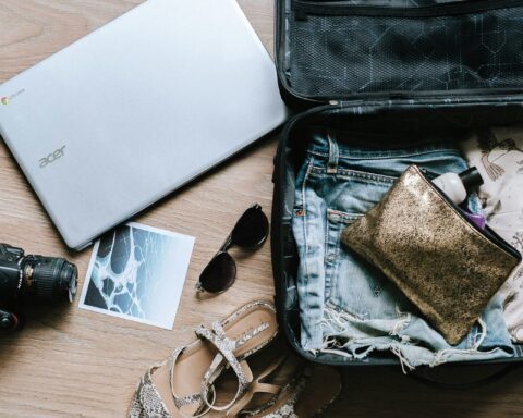 Suitcase, laptop, postcard - Langkawi travel itinerary