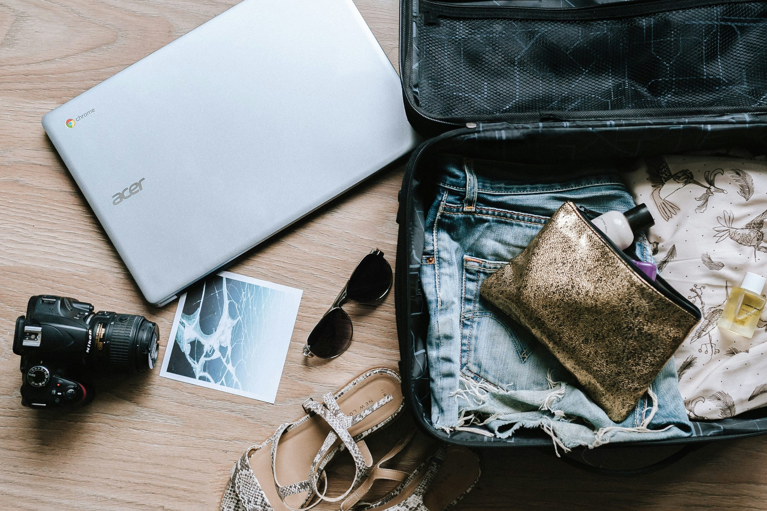 Suitcase, laptop, postcard - Langkawi travel itinerary