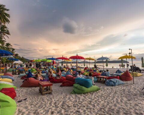 Langkawi nightlife - people enjoy sunset with drinks on the beach