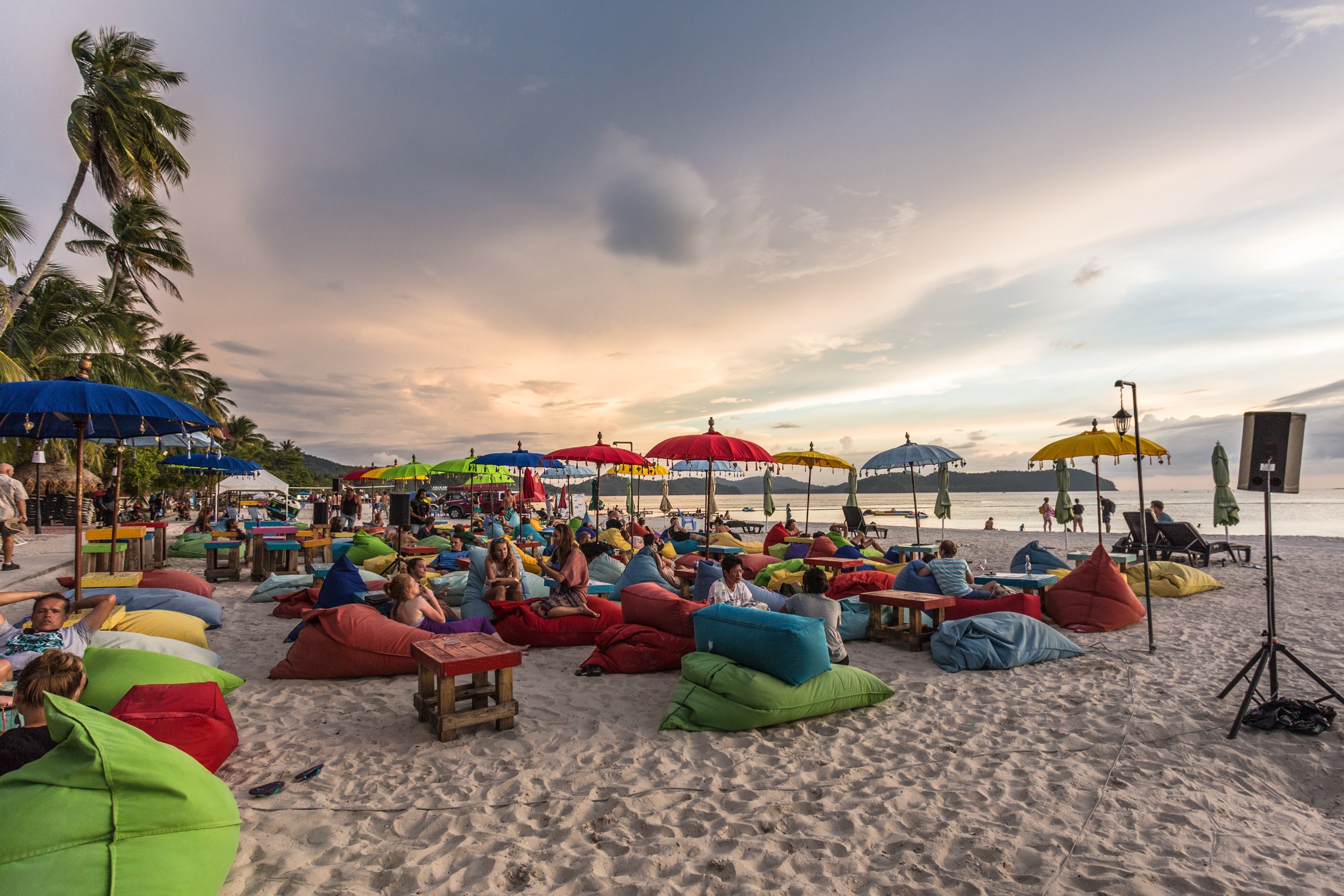 Langkawi nightlife - people enjoy sunset with drinks on the beach